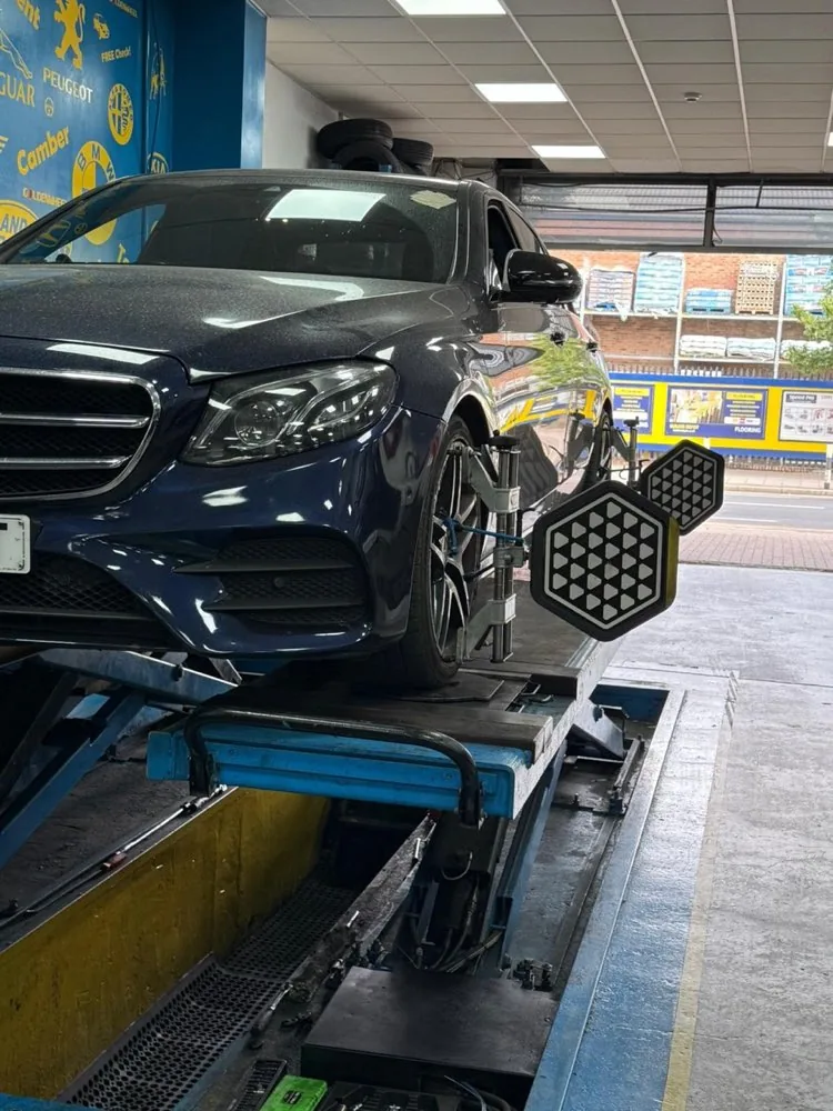 Car on the ramp at Park Royal Tyre & Alignment Centre